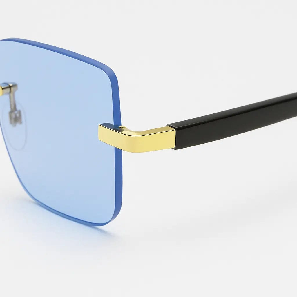 VISQUE AURUM sunglasses with blue lenses and stylish black frame, showcasing vintage charm and modern luxury.